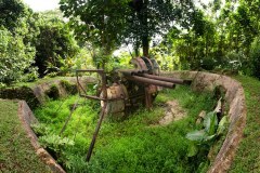 127 mm Japanese anti-aircraft artilly installations from World War II rust in the jungle atop Sokehs Mountain (Pohndollap), Pohnpei, Sokehs Island, Federated States of Micronesia (FSM).