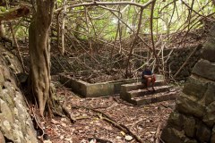 Tanizumi style blast walls around the foundation of a Japanese storage facility for heavy ordnance on Sapwtik Island