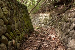 Tanizumi style blast walls around the foundation of a Japanese storage facility for heavy ordnance on Sapwtik Island